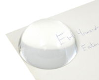 Glass weight on paper